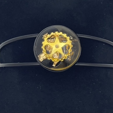 Bracelet jonc cabochon feuilles métallisées et engrenage dorés