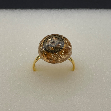 Bague ronde feuilles métallisées dorées et engrenage bronze
